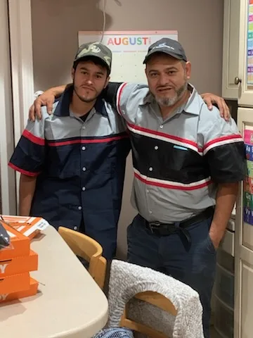 The J and G Refrigeration team in uniform