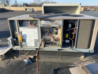 Rooftop condensing unit opened up for repair